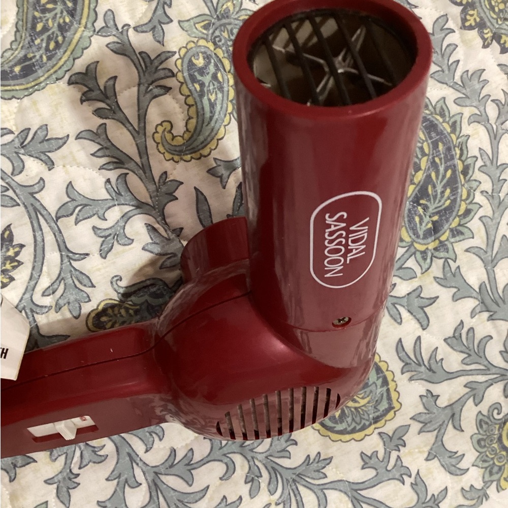 Vidal Sassoon hair dryer. This hair dryer is red and is still in great condition